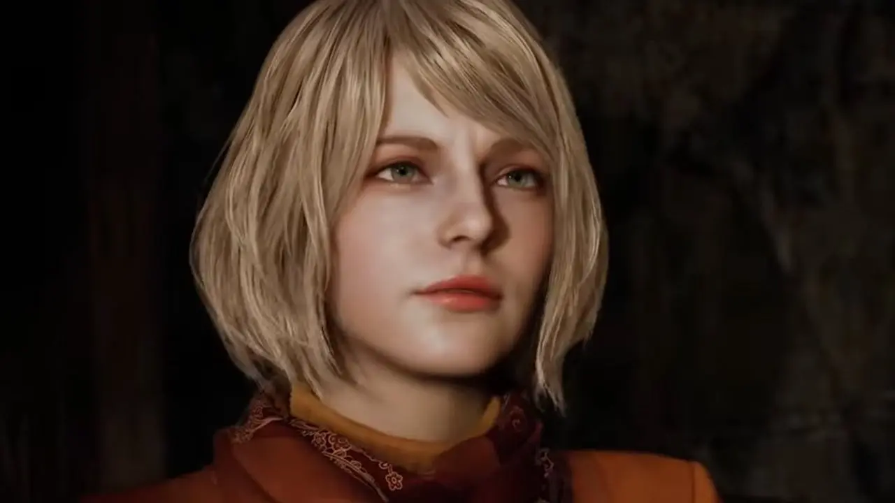Close-up portrait of Ashley Graham from Resident Evil 4 Remake featuring her blonde hair and orange outfit