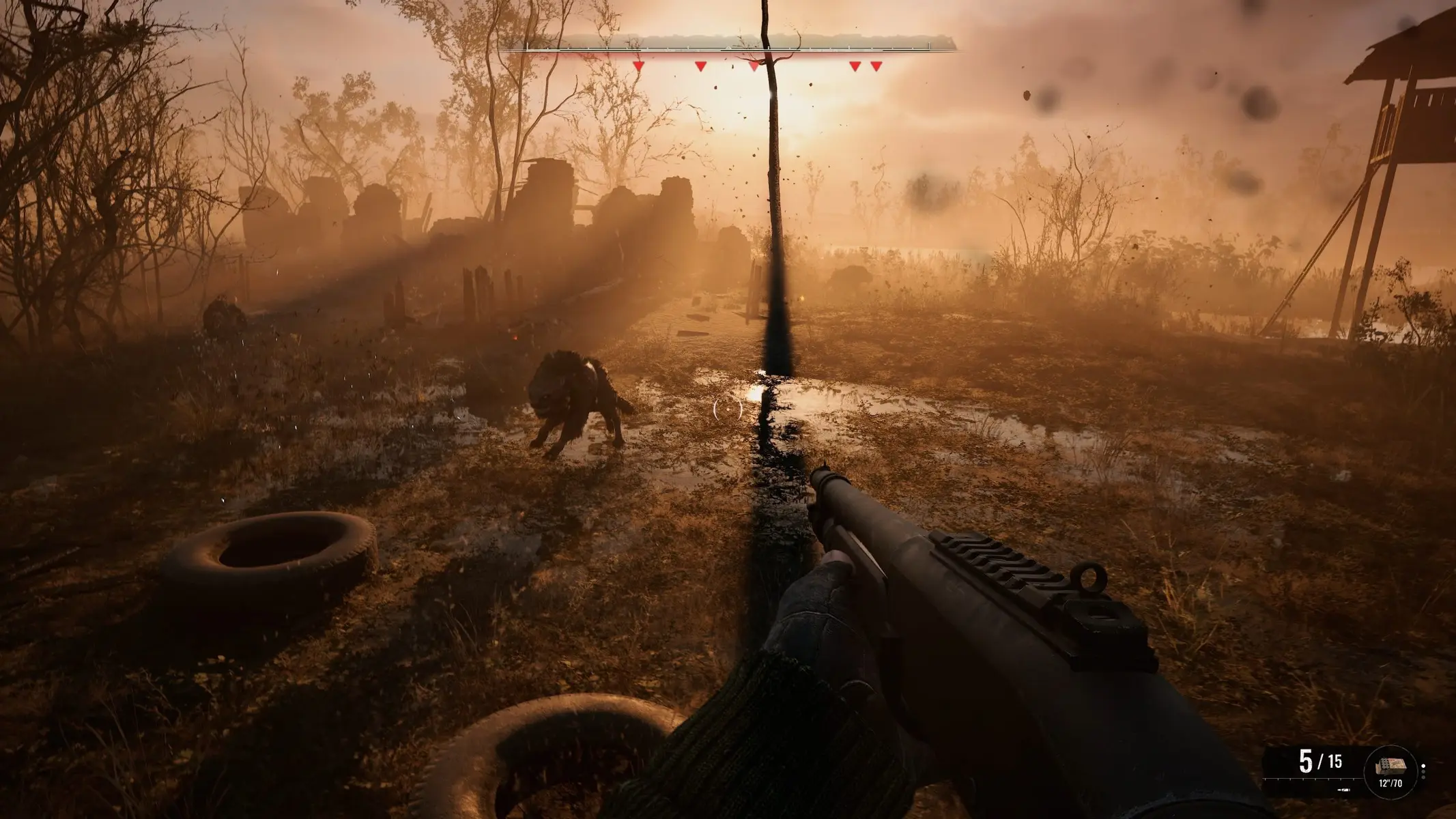 First-person view of a player holding a rifle facing a mutant creature in a foggy, post-apocalyptic landscape